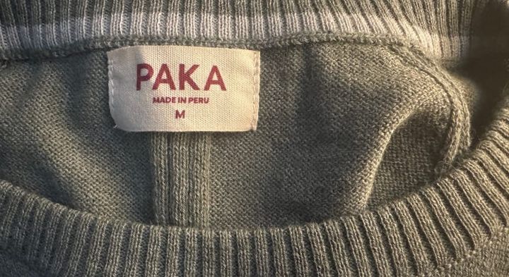  Interior neckline and fabric texture of the PAKA Ultralight COOLPLUS Crew with visible tag marked "Made in Peru"