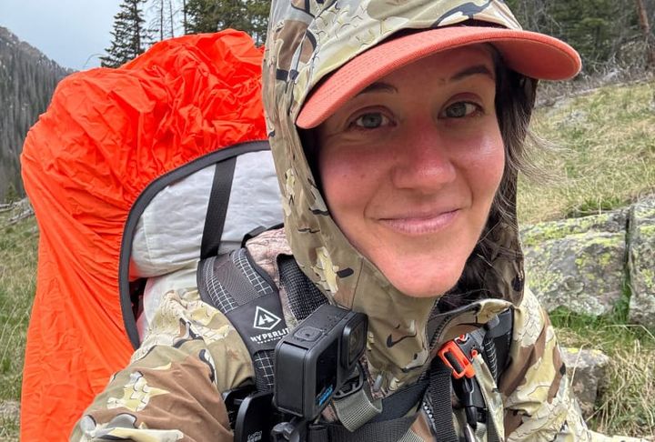 Backpacker in ultralight KUIU gear hiking rugged backcountry terrain during the KUIU Labor Day Sale 2025 with up to 50% off hunting apparel and packs.