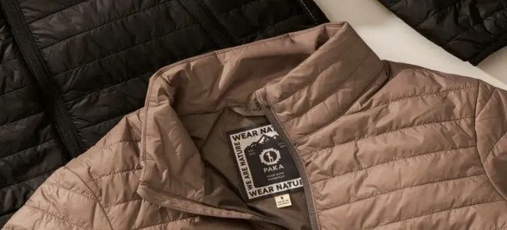 Close-up of PAKA Mayu Ultralight jackets and vests in black, maroon, and tan, featuring lightweight design and sustainable PAKAFILL® alpaca insulation.