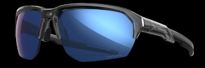  Person wearing Wiley X outdoor sunglasses while hiking in rugged desert terrain during morning hours.