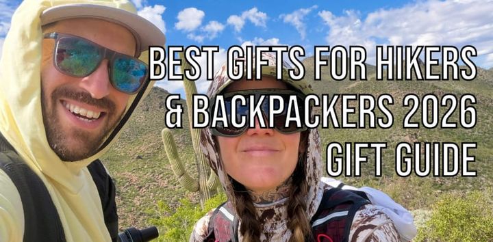 Two hikers wearing sun hoodies, sunglasses, and backpacks on a sunny Sonoran Desert trail, with text reading Best Gifts for Hikers & Backpackers 2026 Gift Guide.