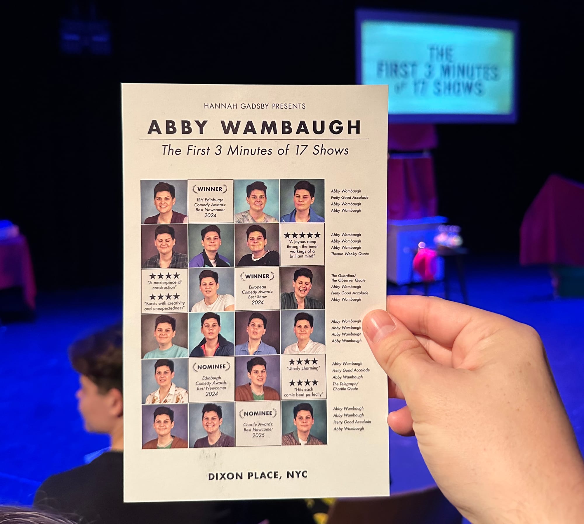 Flyer for Abby Wambaugh's show with good reviews, with the stage in the background.