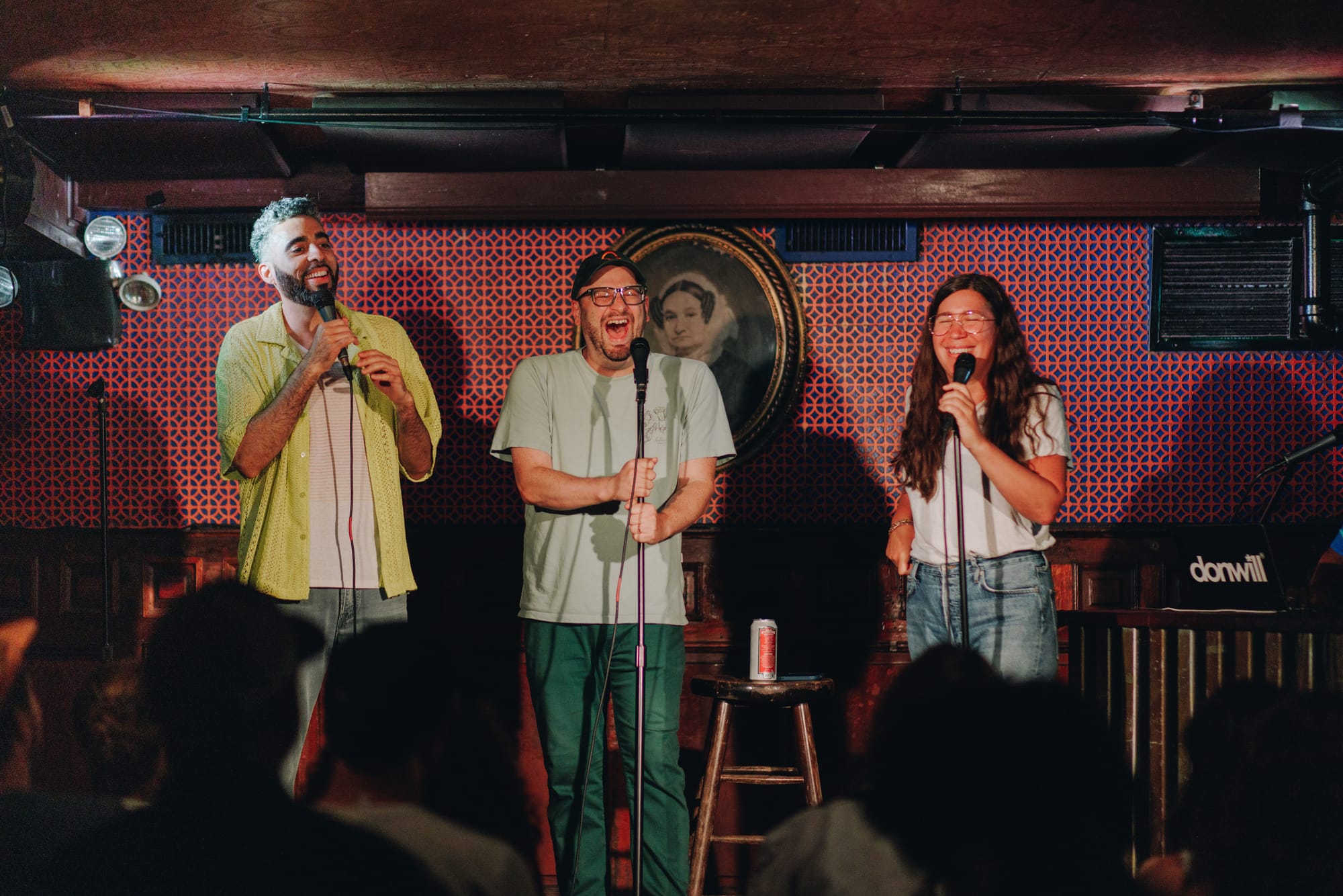 Tyrone, Me, and Alison on stage at Union Hall laughing. Donwill's laptop is visible but Donwill is out of frame.