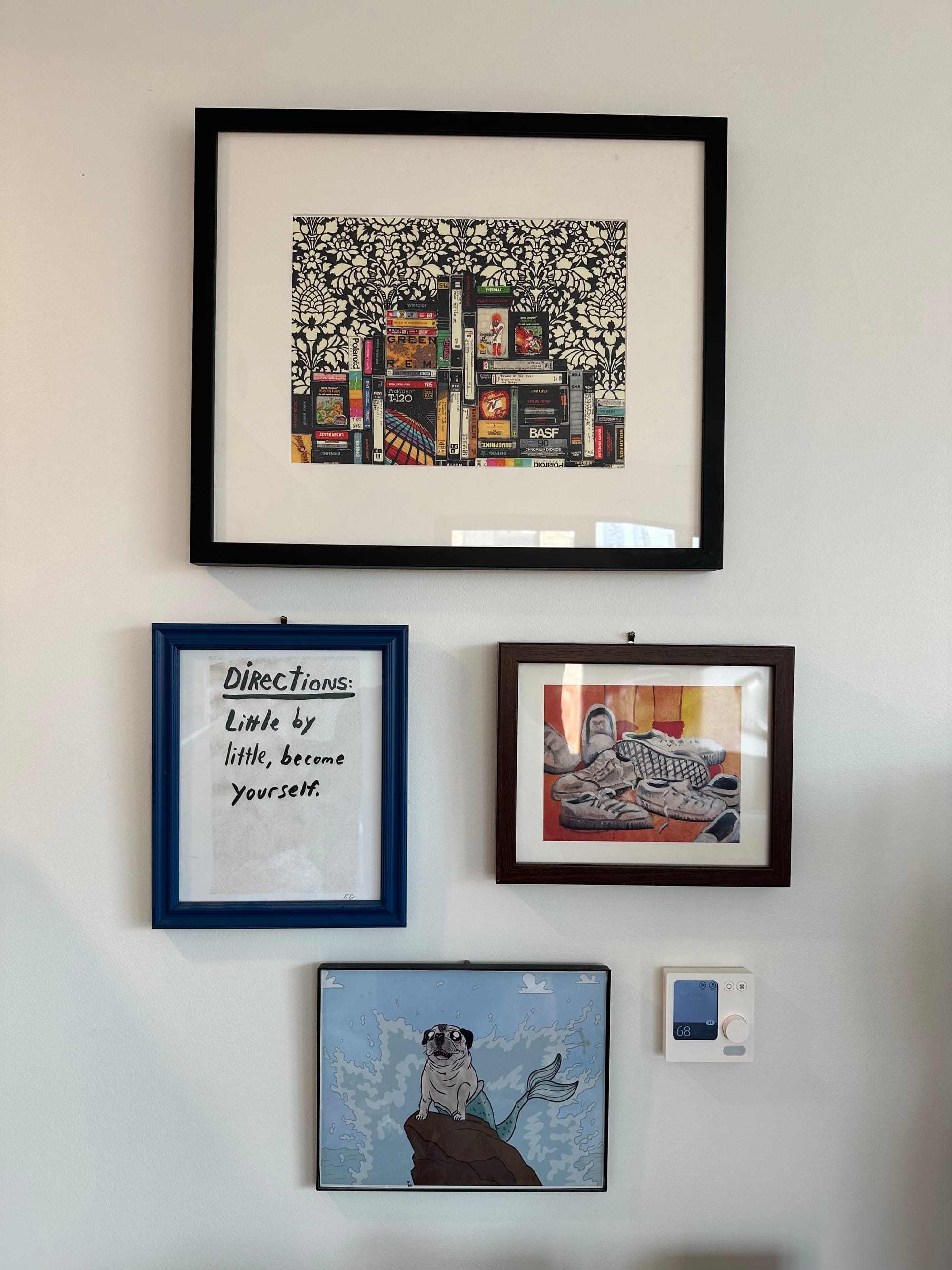 Four pieces of art: A print of a painting of VHS cassettes, a hallie bateman print that says directions: little by little become yourself, a pug mermaid by mattie lubchansky, and white sneakers in a heap by doug gately