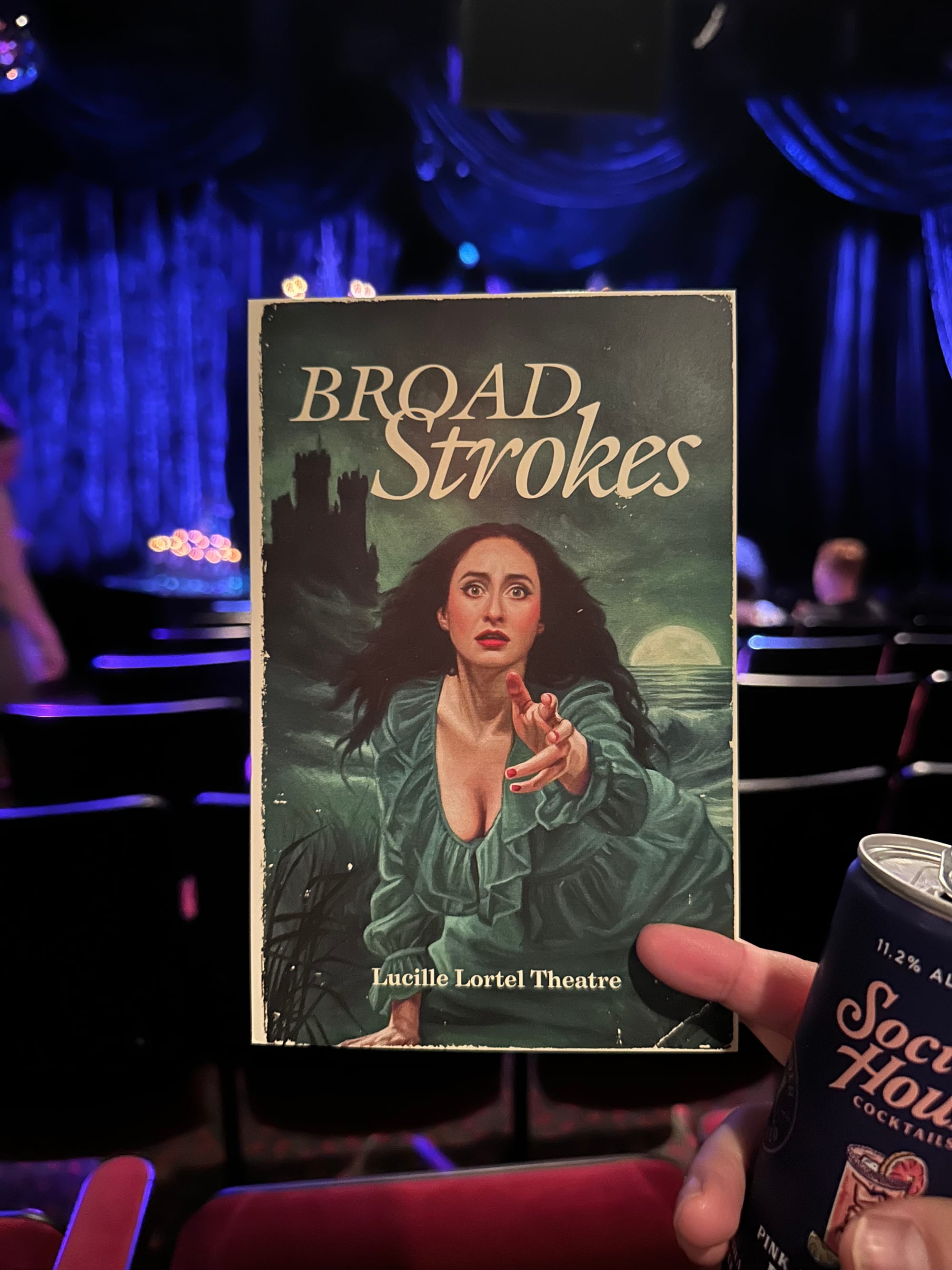 Program for Cat Cohen's show at the Lucille Lortel Theater with my canned cocktail visible in the corner.