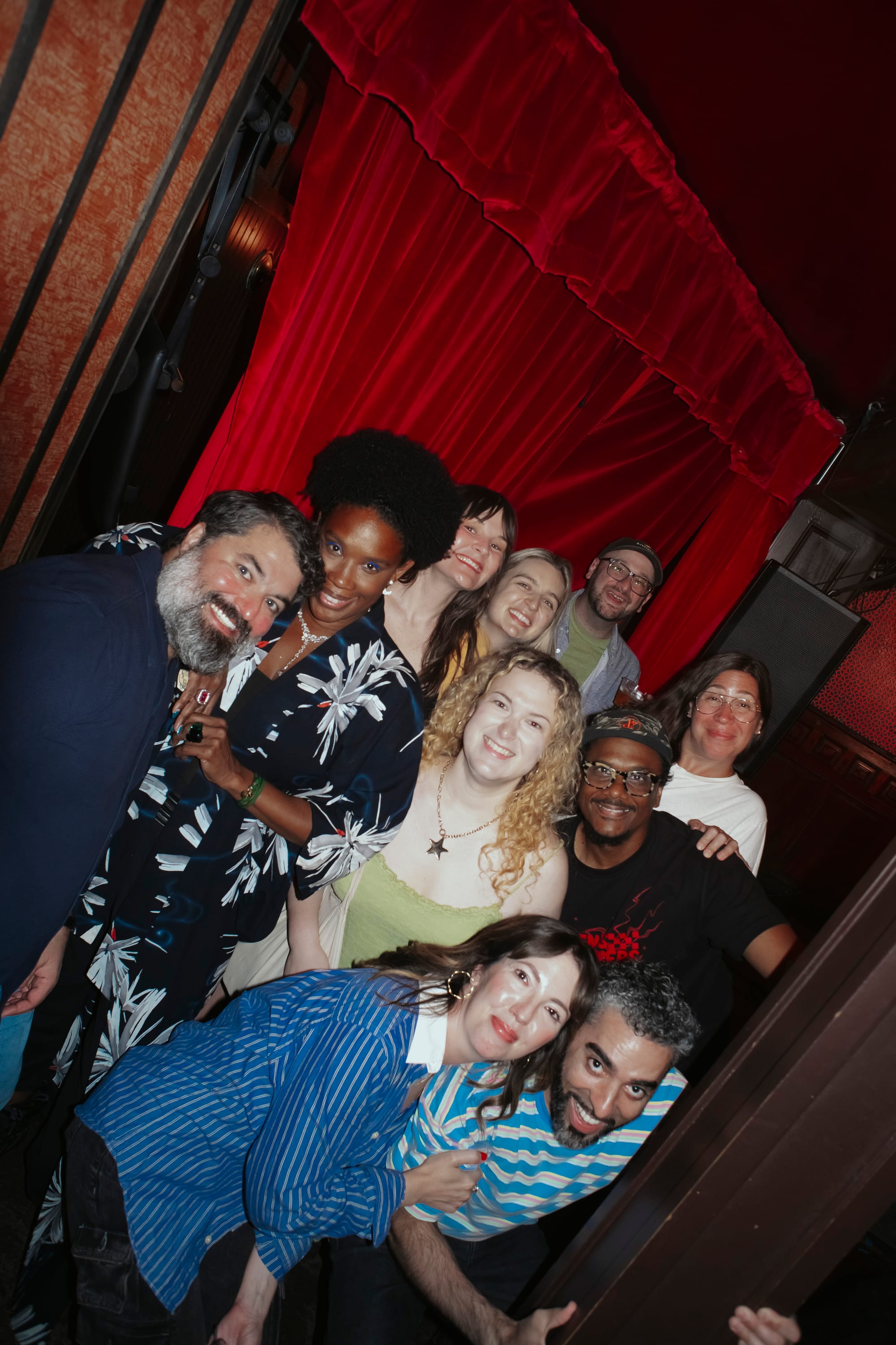 Sean Patton, Joyelle Nicole Johnson, Sarah Hennessey, Holmes, me, Leiby, Donwill, Esther Fallick, Jordan Ashleigh, and Tyrone Thornhill in front of the red curtain at Union Hall.