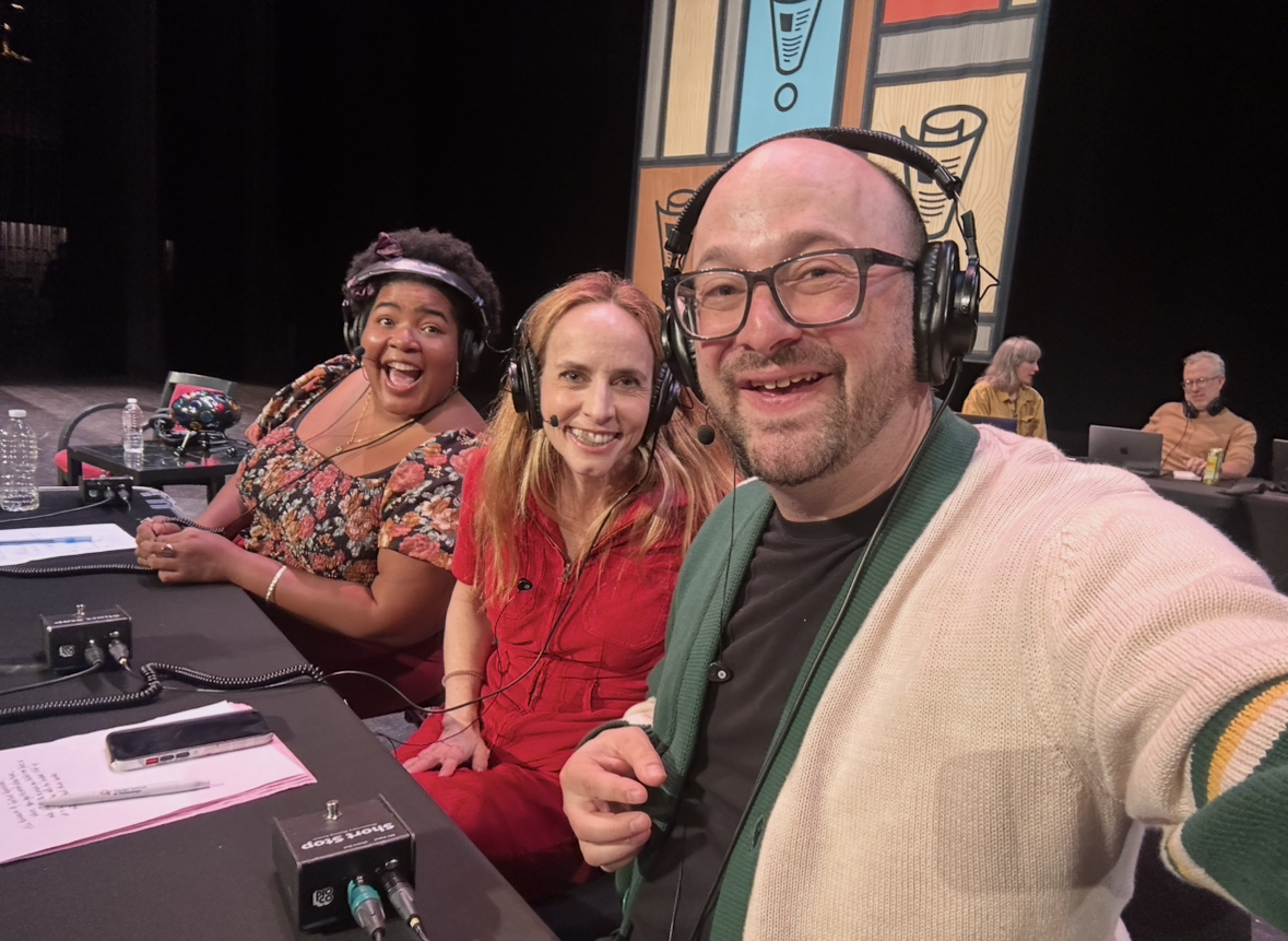 me, faith, and dulcé at the panelists table for wait wait; mike danforth and lillian king are behind us at the producer table