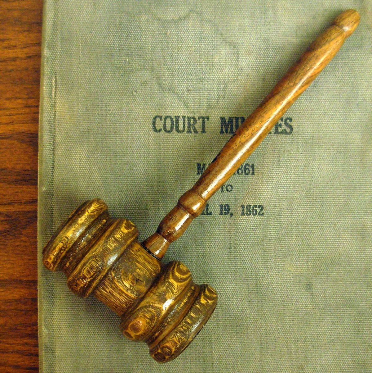 Gavel on notes from a court case. Just like below.