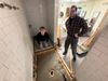 Two PBE brothers working to prepare subfloor in shower to receive new shower base.