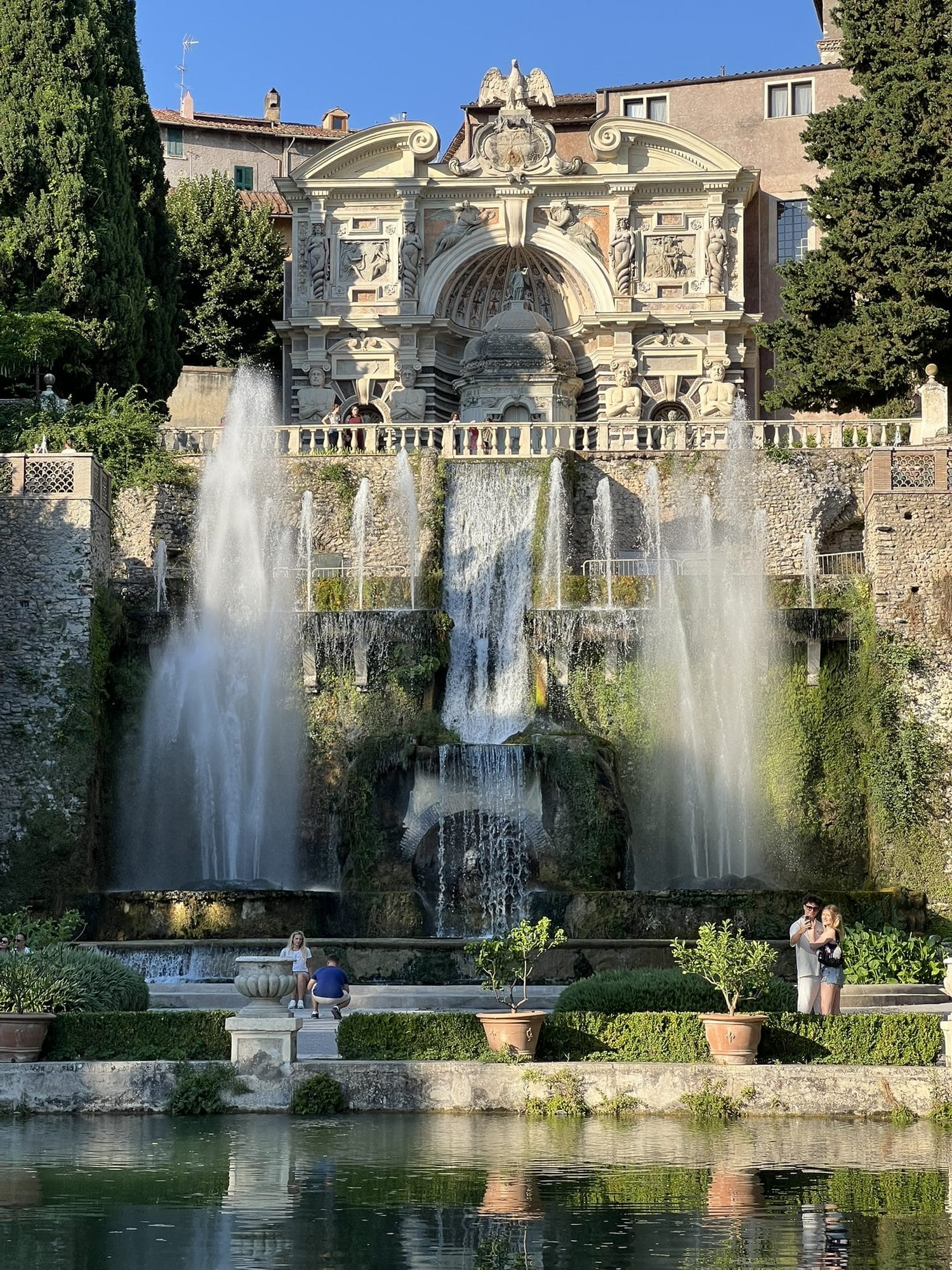 The Fountain of Neptune with tall jets and cascades, crowned by the façade of the Fountain of the Organ and reflected in the fishponds