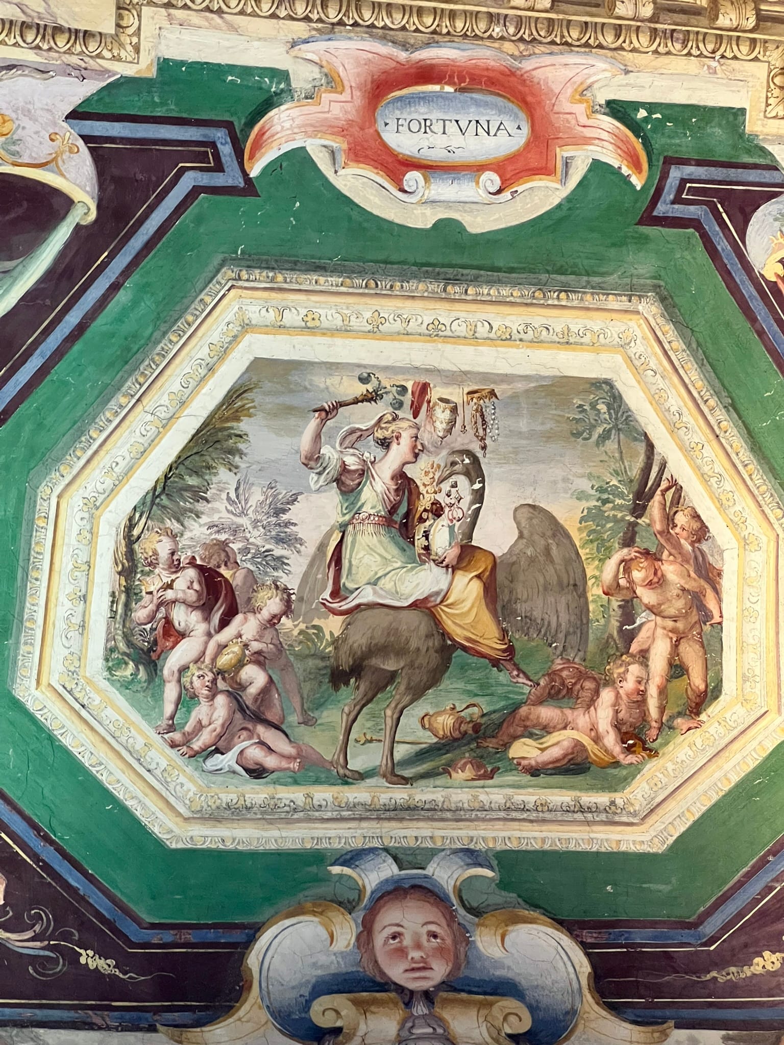 Octagonal fresco of Fortune riding an ostrich among putti, beneath a cartouche inscribed FORTVNA