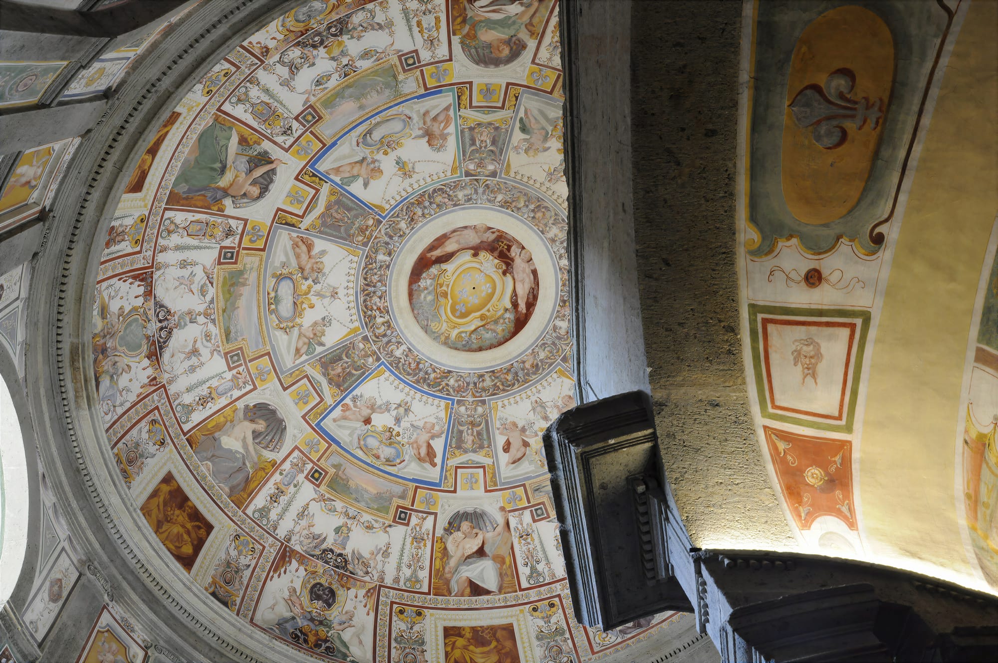 Painted dome above the spiral Scala Regia at Palazzo Farnese, Caprarola, with the Farnese lilies at the centre