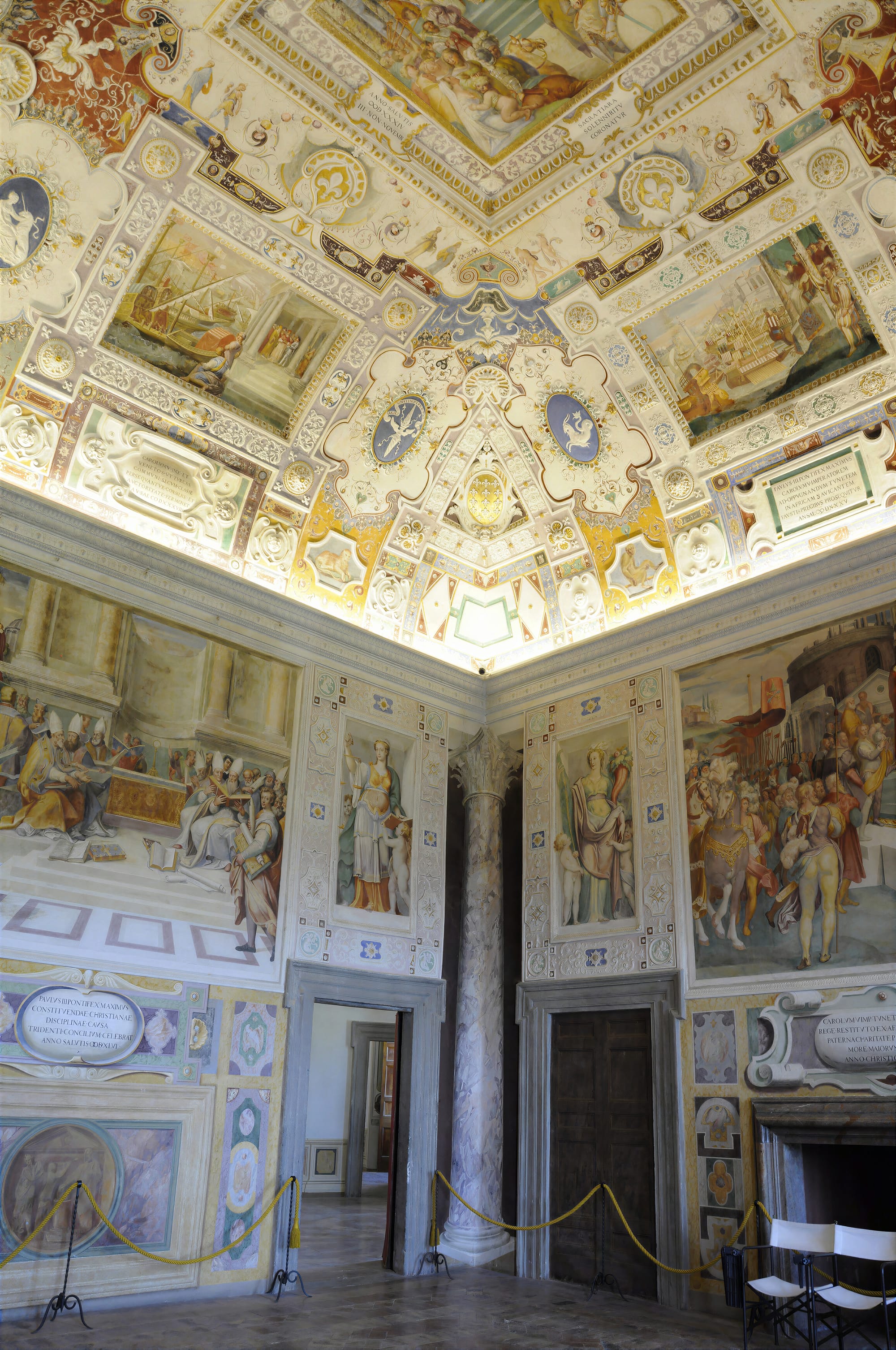 Corner of the Anticamera del Concilio at Caprarola, with the opening of the Council of Trent on the left, Charles V on the right and a painted column between them