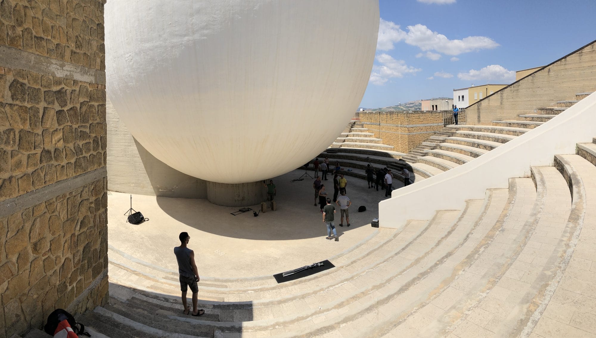Stepped seating curving around the great white sphere of the Chiesa Madre in Gibellina