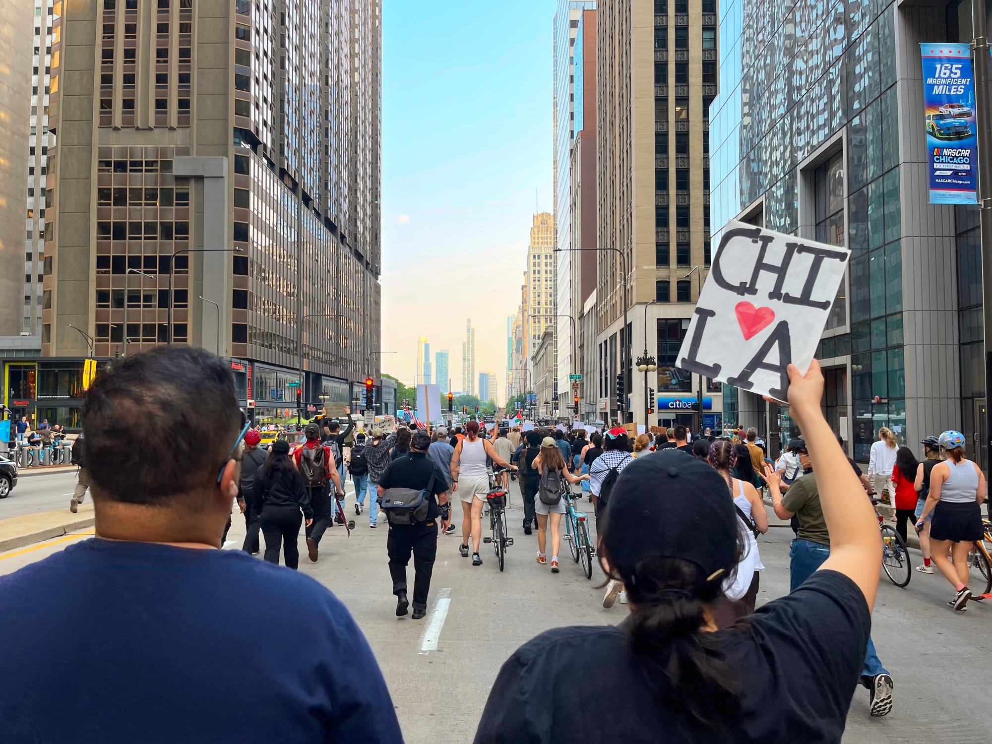 Protesters march down a city street in Chicago.