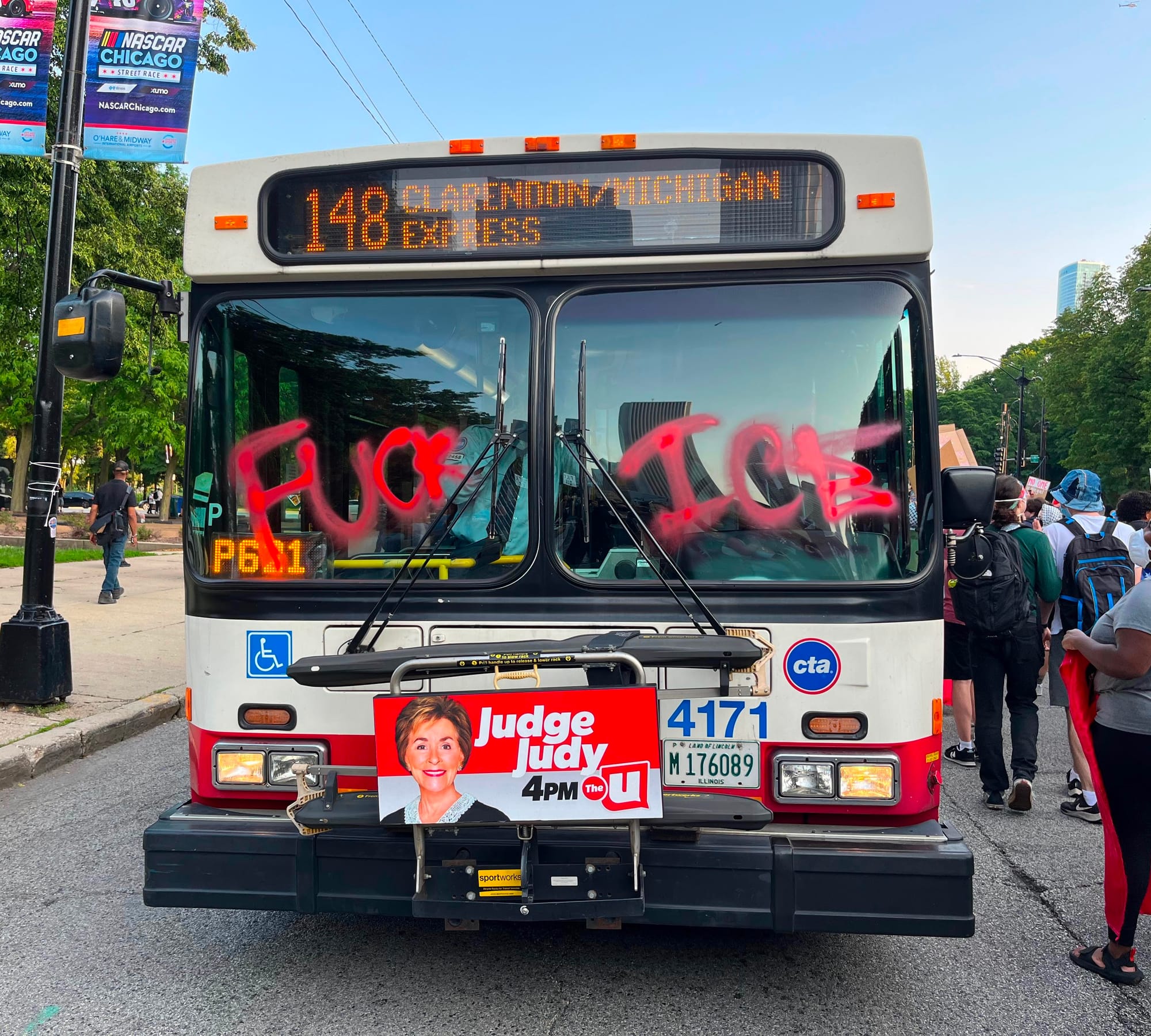 A Chicago city bus with the words "FUCK ICE" spray painted on its windshield.