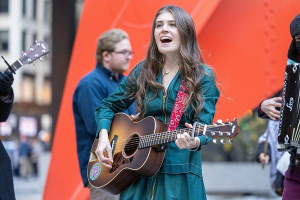 Joselyn Walsh playing guitar.