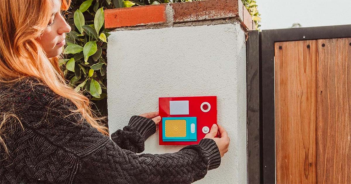 An image of a Star Trek doorbell with a woman next to it.