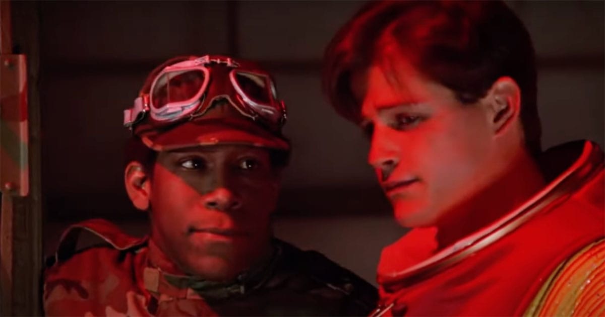 Image of David and another officer getting ready to send David back.