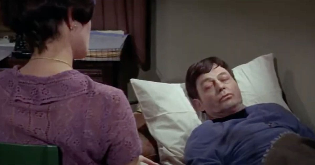 Dr. McCoy lies unconscious in bed while Edith Keeler watches over him in "The City on the Edge of Forever."