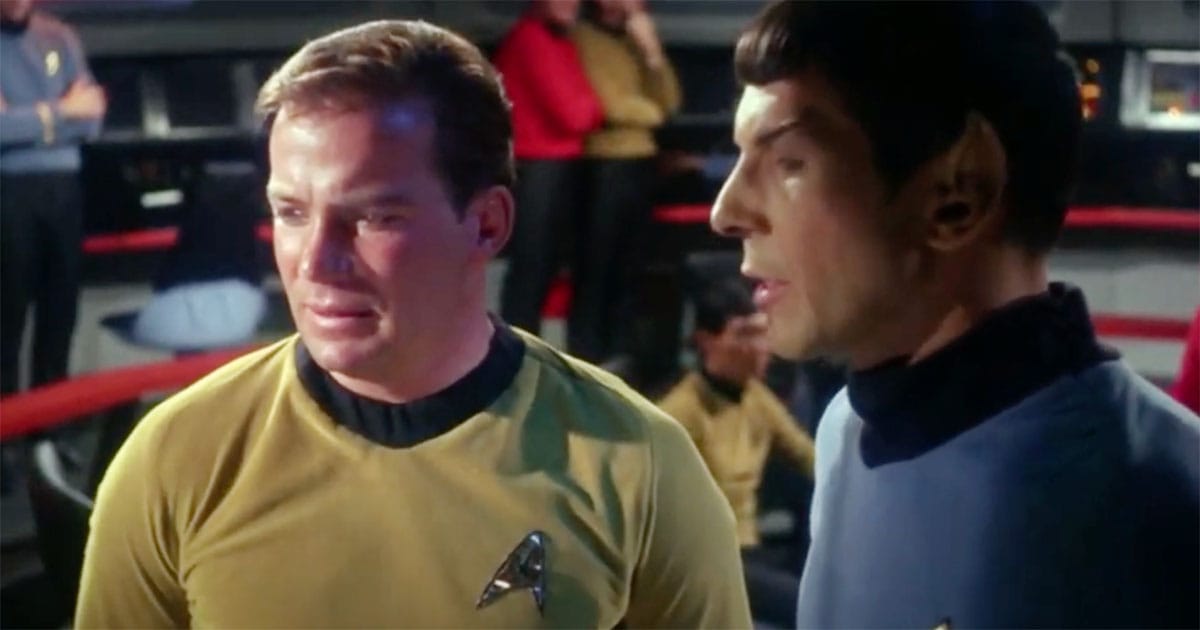 Kirk and Spock in conversation on the bridge of the Enterprise in "Star Trek."