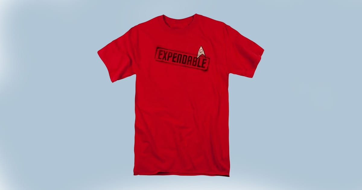 Red T-shirt with bold “Expendable” label—straight talk for fans who know what it means to beam down first and ask questions never.