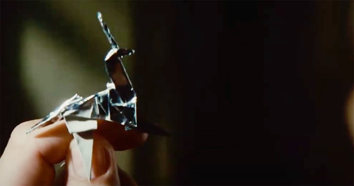 Origami unicorn held in hand, symbolizing memory and identity in Blade Runner.