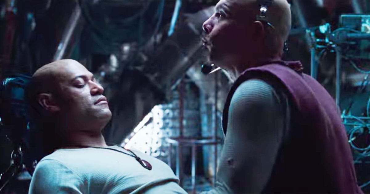 Cypher stands over Morpheus during a critical betrayal scene in "The Matrix."