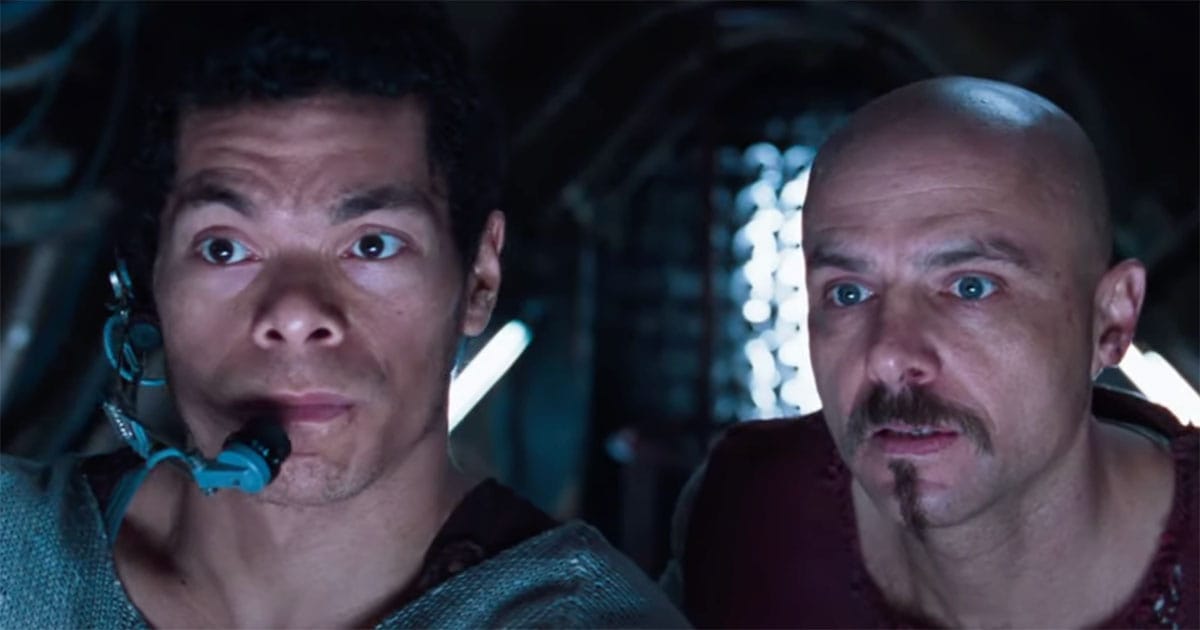 Tank and Cypher watch the Matrix interface aboard the Nebuchadnezzar in "The Matrix."