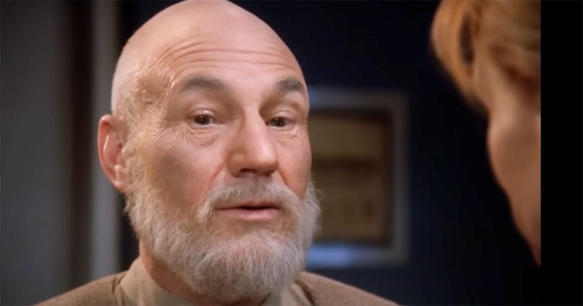 Bearded Picard in civilian clothes, speaking thoughtfully in his later years.