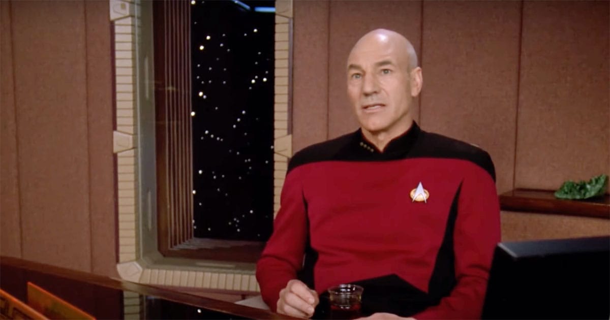 Captain Picard seated with a cup of Earl Grey tea, looking out into space from his ready room aboard the Enterprise.