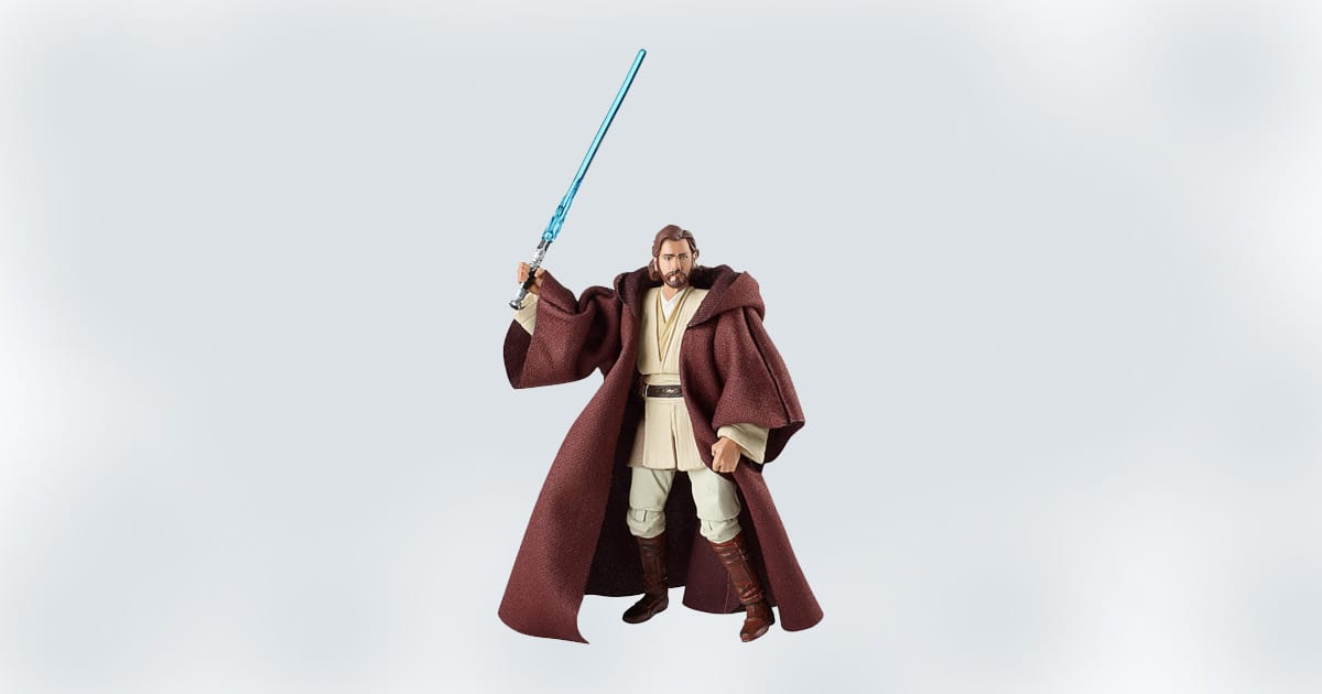 Obi-Wan Kenobi action figure wielding a blue lightsaber in Jedi robes.