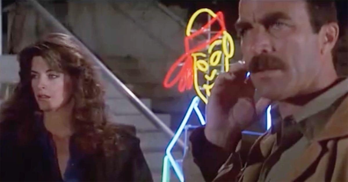 Tom Selleck and Kirstie Alley as Ramsay and Jackie in a restaurant at night preparing for an exchange with Luther in the film "Runaway."