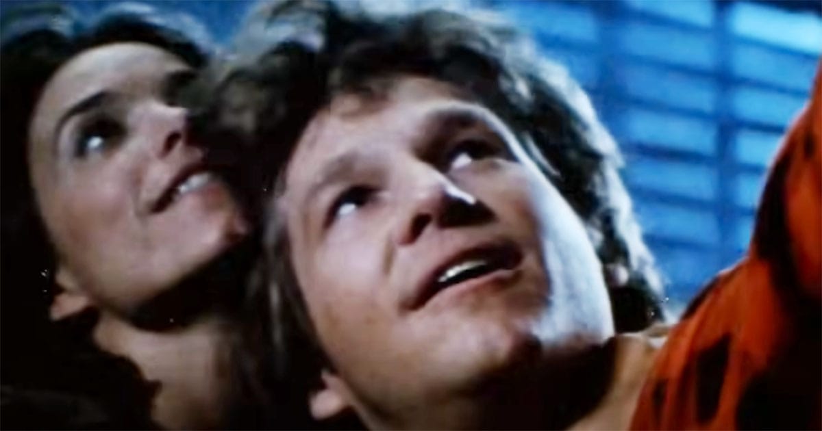 Jeff Bridges and Karen Allen looking upward together in a hopeful scene from "Starman."