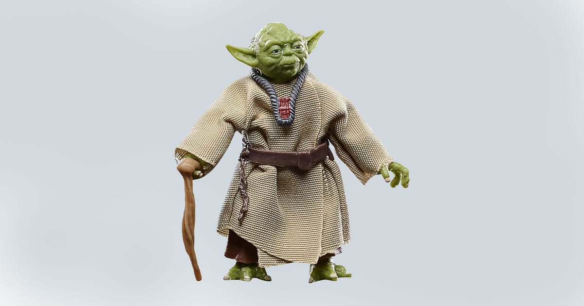 Yoda action figure wearing a cloth robe and holding a cane, based on his appearance in "The Empire Strikes Back," posed against a light background.
