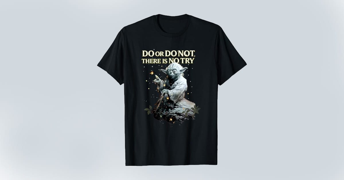 Black T-shirt featuring Yoda seated with his cane and the quote "Do or do not. There is no try" above him, surrounded by stars and foliage.