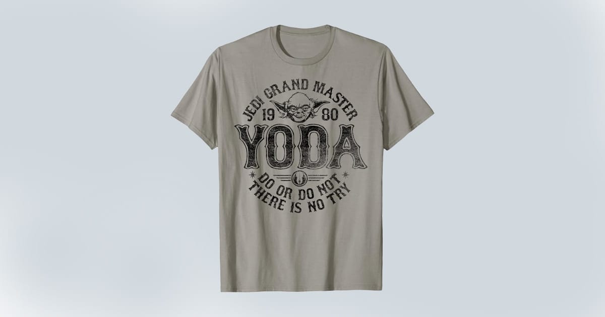 Gray T-shirt with a vintage-style print of Yoda’s face and text reading "Jedi Grand Master 1980 Yoda Do or Do Not There Is No Try."