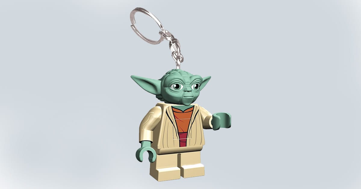 LEGO Yoda keychain figure with articulated arms and a metal key ring, featuring the character in tan robes with green skin and large ears.