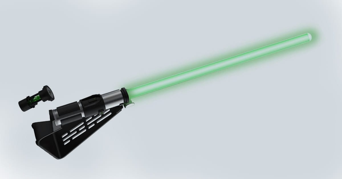 Green-bladed Yoda Force FX Elite lightsaber with detailed hilt, display stand, and removable Kyber Crystal, shown on a light background.
