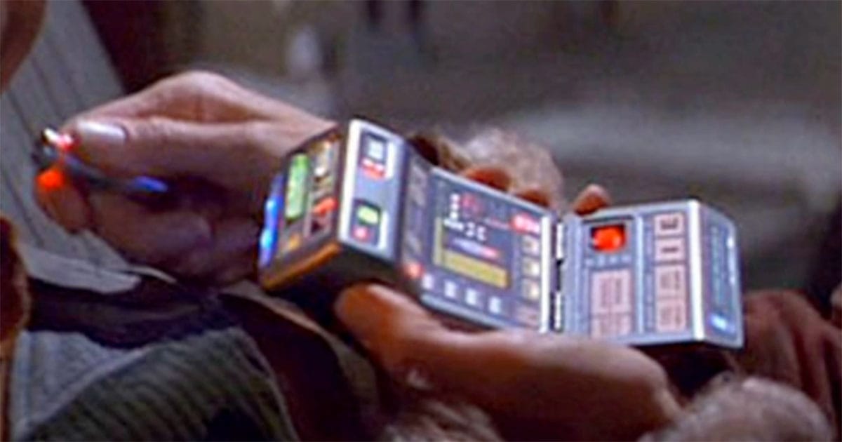 Starfleet officer using a tricorder in "Star Trek," an early vision of portable medical and scientific scanning technology.