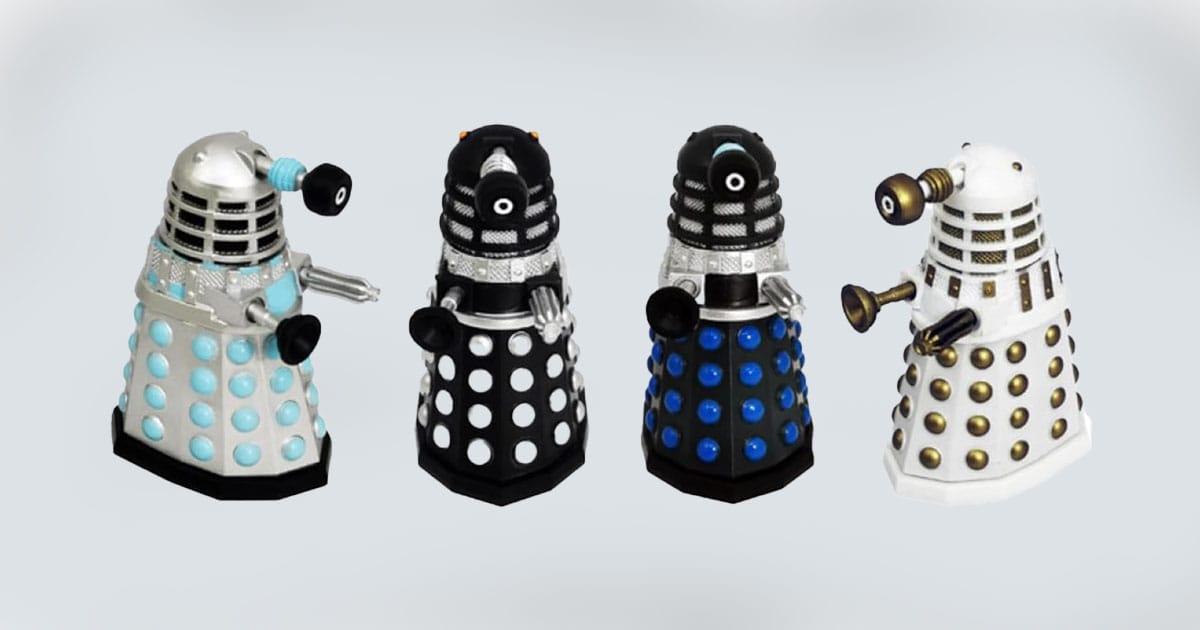 Set of four "Doctor Who" Dalek figures in varied colors and classic styles.