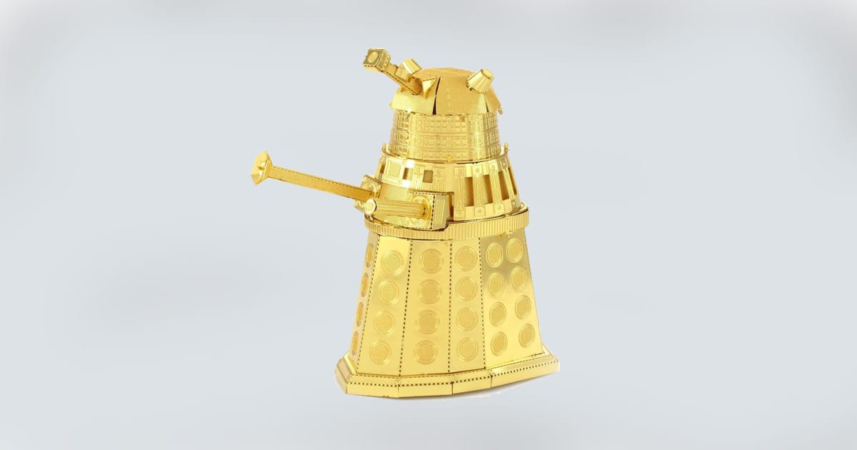 Gold metal model of a Dalek from "Doctor Who" crafted in intricate detail.