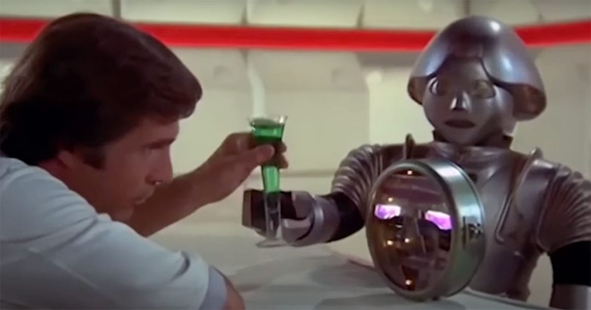 Buck Rogers offering a green cocktail to Twiki the robot, who holds a matching drink with Dr. Theopolis on his chest.
