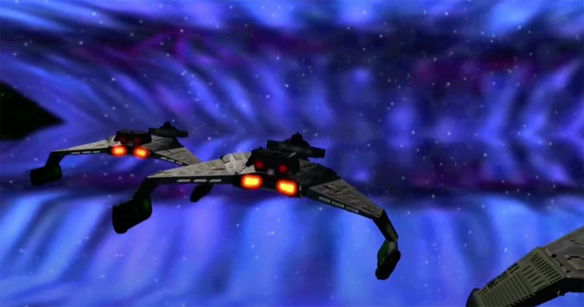 Three Klingon battlecruisers approach a swirling energy cloud in space during the opening of "Star Trek: The Motion Picture."