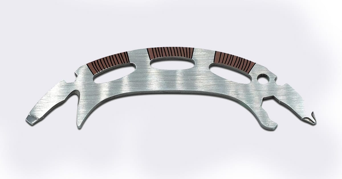Compact 6-in-1 multitool shaped like a Klingon bat'leth, featuring a brushed metal finish and ergonomic grip inlays, inspired by "Star Trek" weapon design.