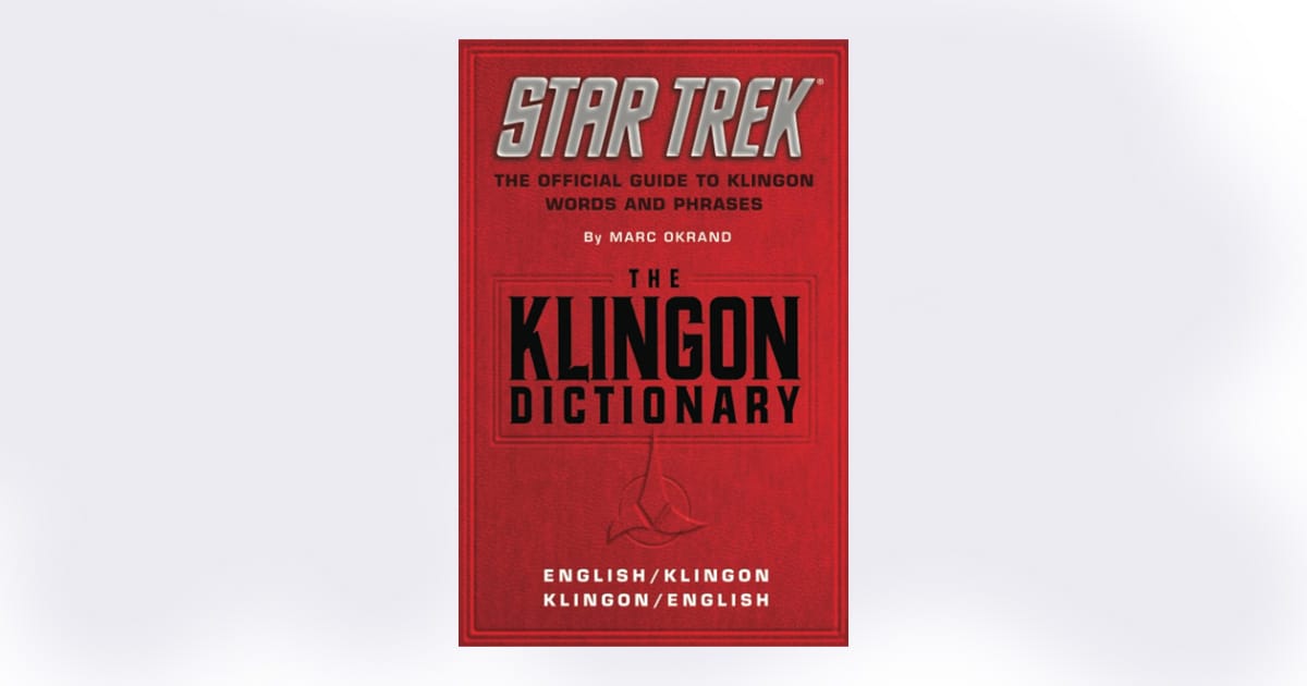 Red cover of "The Klingon Dictionary" by Marc Okrand, featuring English to Klingon and Klingon to English translations with official "Star Trek" branding.