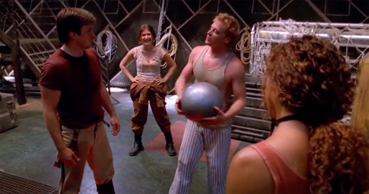 Wash joking with Mal and the crew aboard Serenity during a relaxed moment, symbolizing the camaraderie and warmth lost with his death in "Serenity" (2005)