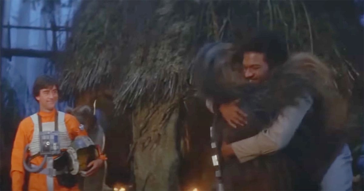 Chewbacca hugging Lando Calrissian during the Ewok celebration in "Return of the Jedi" (1983)
