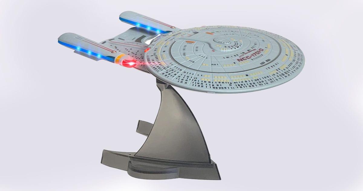 U.S.S. Enterprise NCC-1701-D Bluetooth speaker replica with illuminated nacelles on a display stand