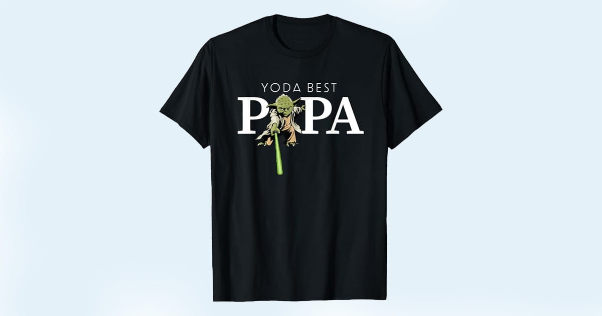 Black T-shirt with Yoda holding a lightsaber and the phrase "Yoda Best Papa" integrated into bold white text
